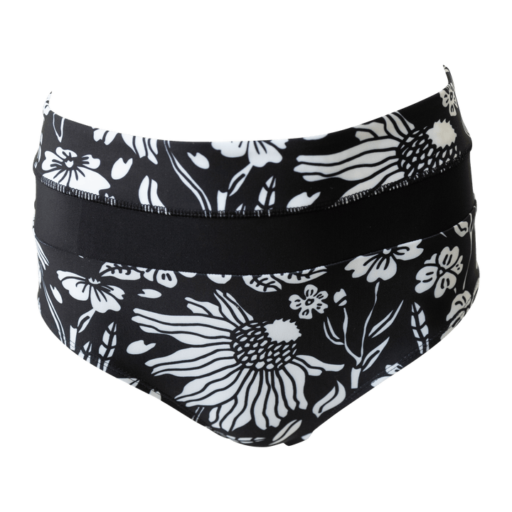 Flat lay image of black and white floral patterned swimsuit bottoms.