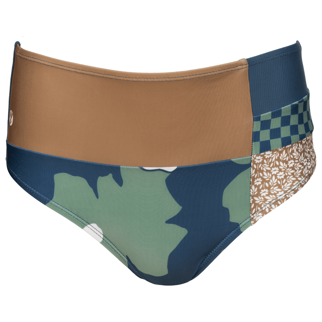 Mid Rise swim bottoms with patches of different designs. Patches include solid brown, floral print, navy, checkered navy and green and brown floral print. Swim bottoms on a white background.