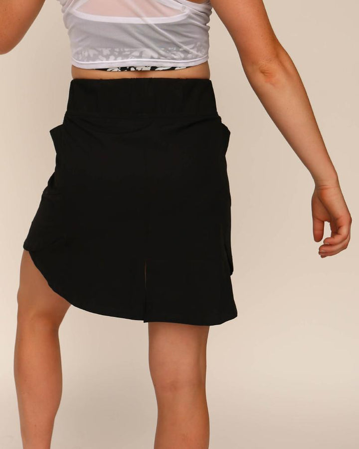 A studio image of a black athletic skirt.